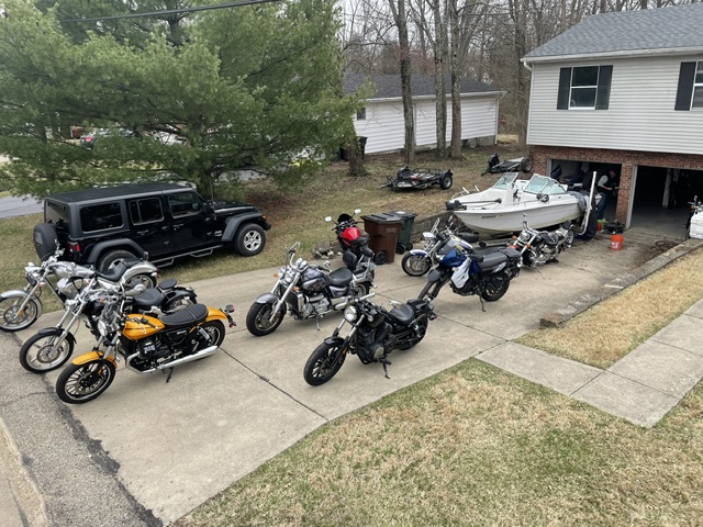 The whole stable — Jeep, bikes, the boat.